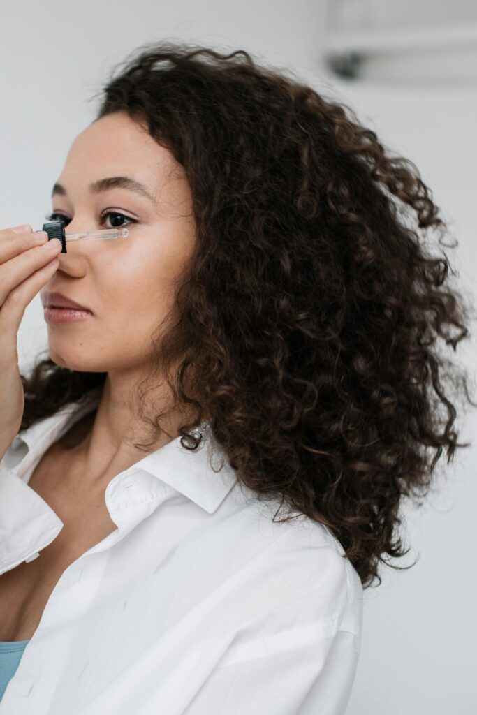 woman applying serum